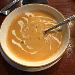 Delaney's Tavern signature dishes Blue Crab BeignetsLobster BisqueAlmond Crusted Salmon
